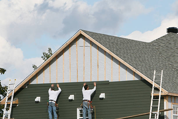 Professional Storm Damage Siding Repair technician working in Harmony, NC